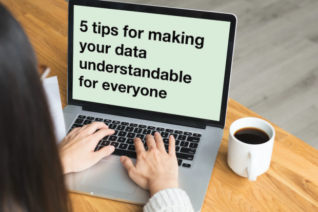 View over the shoulder of a person using the laptop with the screen showing the text '5 tips for making your data understandable for everyone'